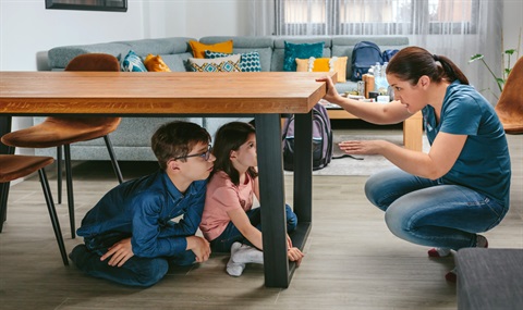 Mom talking to kids under table decorative photo