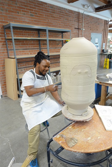 Visiting Artist Andile Dyalvane working in the ceramics studio