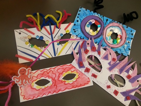 Paper masks made by children at an Art Center birthday party