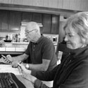 older aged couple using their computers
