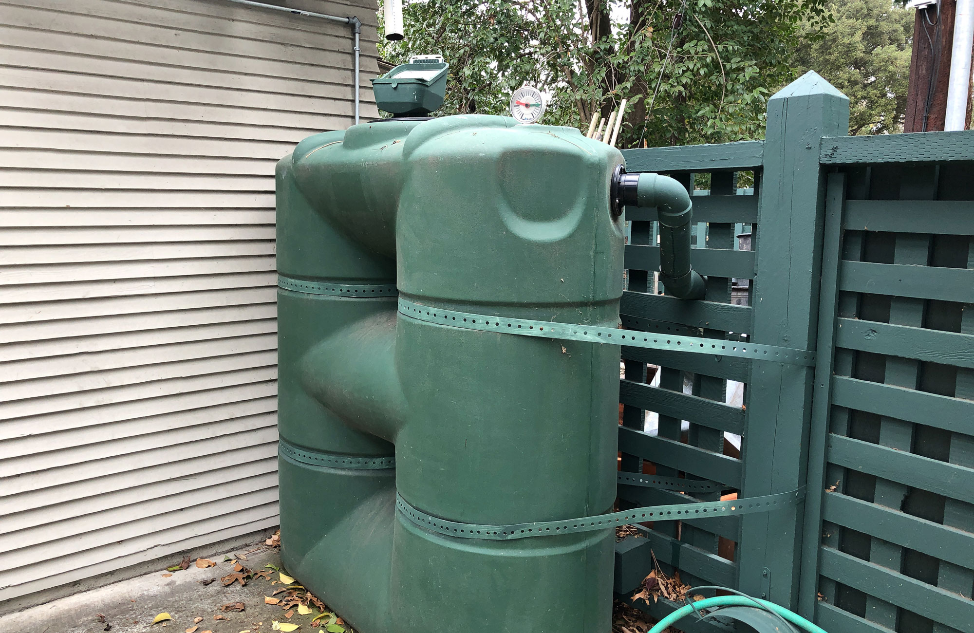 Rainwater harvesting via above-ground cistern.