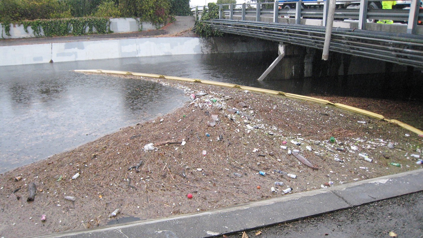 Trash Boom in Matadero Creek during a rain event holding back debris