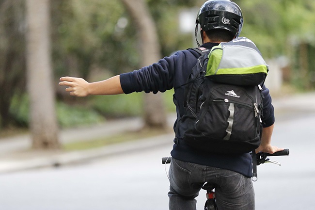 man-on-bike-signaling-with-his-arm.jpg