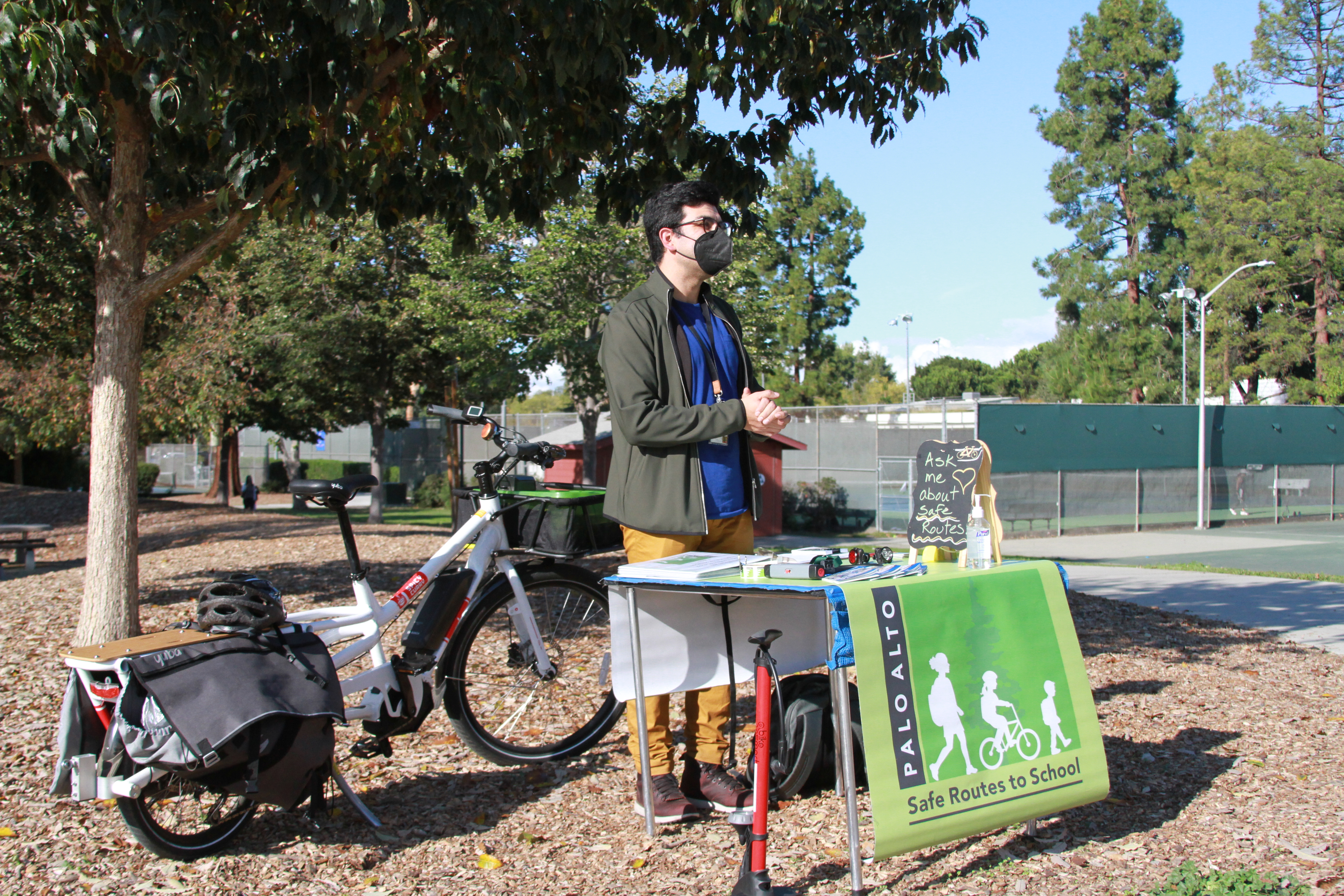 A man stands in front of a bike at the MIKE pop-up