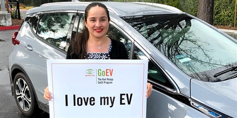 Woman in front of new EV.