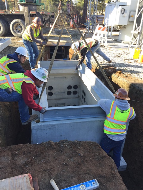 utility workers installing a duct bank