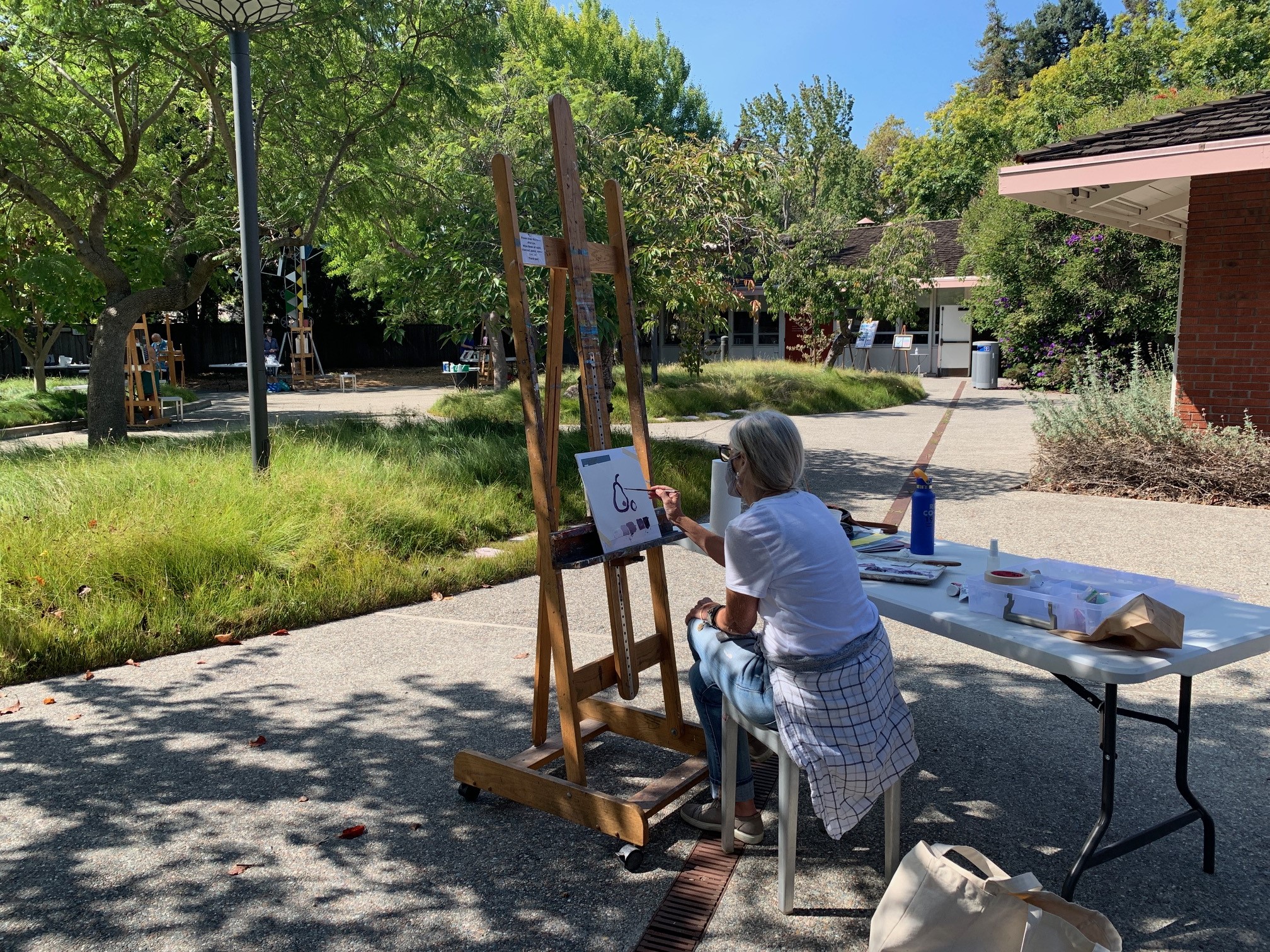participant in an outdoor painting class
