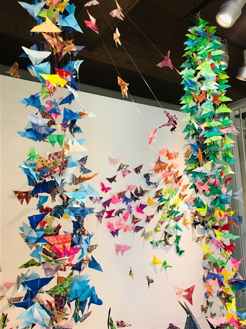 Cascades of colorful paper butterflies