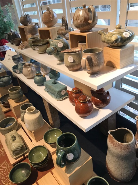 image of shelves of ceramic artworks at the last studio sale